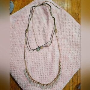 4 layer adjustable clasp necklace with different colored chains and white beads